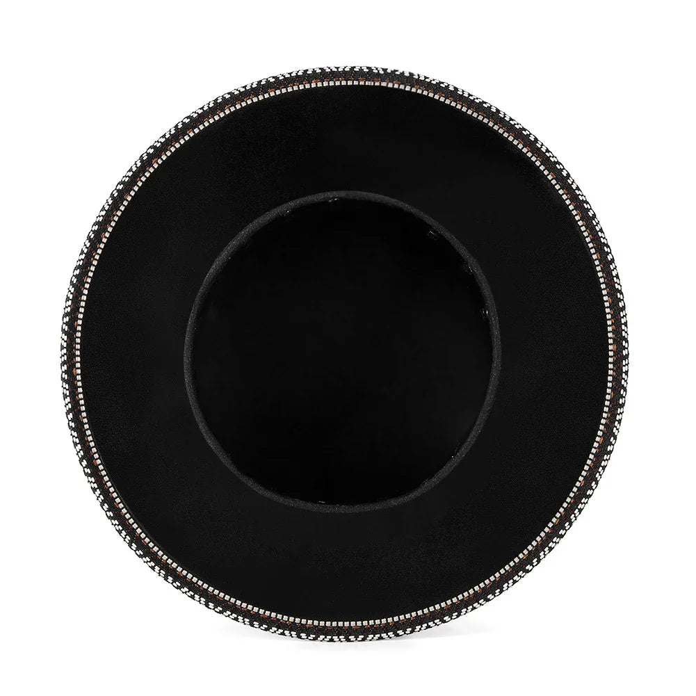 A black punk-style top hat with an embossed skull design, made of premium PU leather.