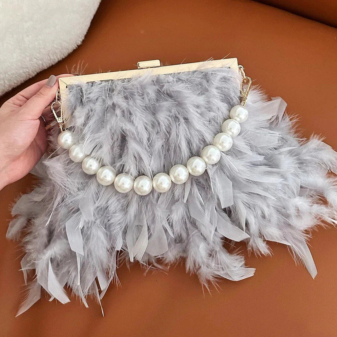 Elegant gray feather and pearl clutch with metal framework, a sophisticated accessory for Kiwi fashionistas