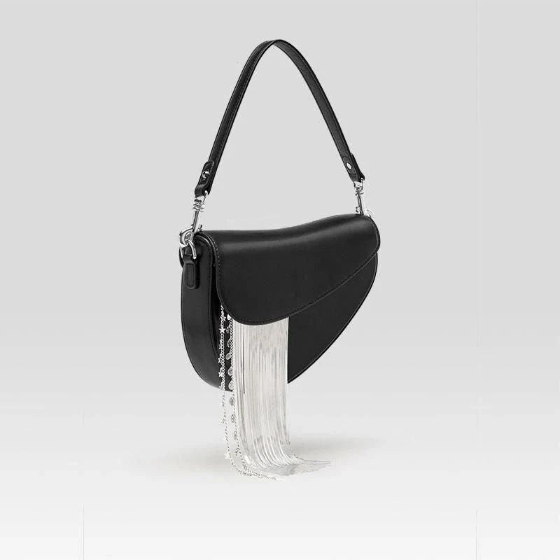 Stylish leather crossbody saddle bag with trendy tassel detail, perfect for everyday use or formal occasions