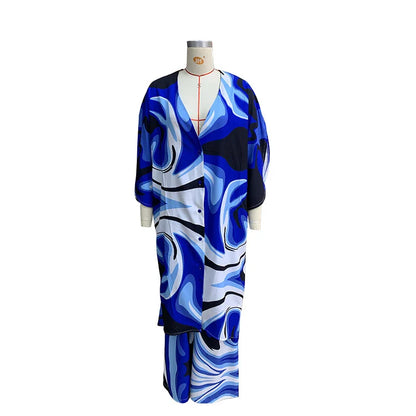 Stylish two-piece set with batwing sleeve top and wide-leg trousers in a vibrant tie-dye pattern