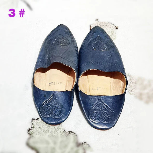 Handcrafted Moroccan leather slippers with pointed-toe design and cushioned insoles for comfort and style