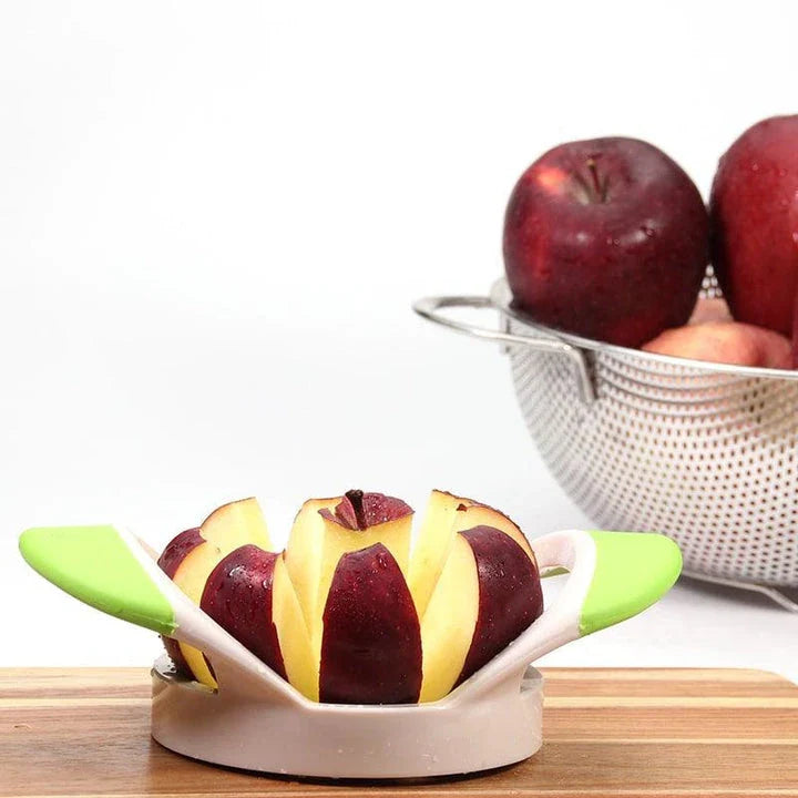 Stainless steel fruit cutter with ergonomic grip, slicing various fresh produce