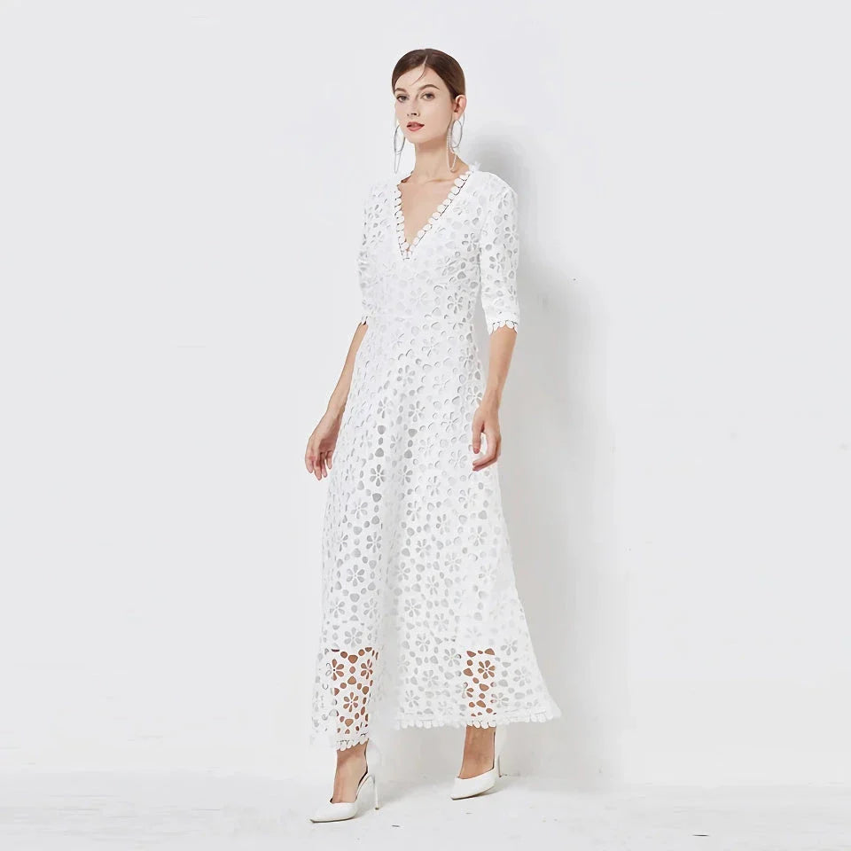 A white lace maxi dress with a stylish V-neck design, perfect for special occasions.