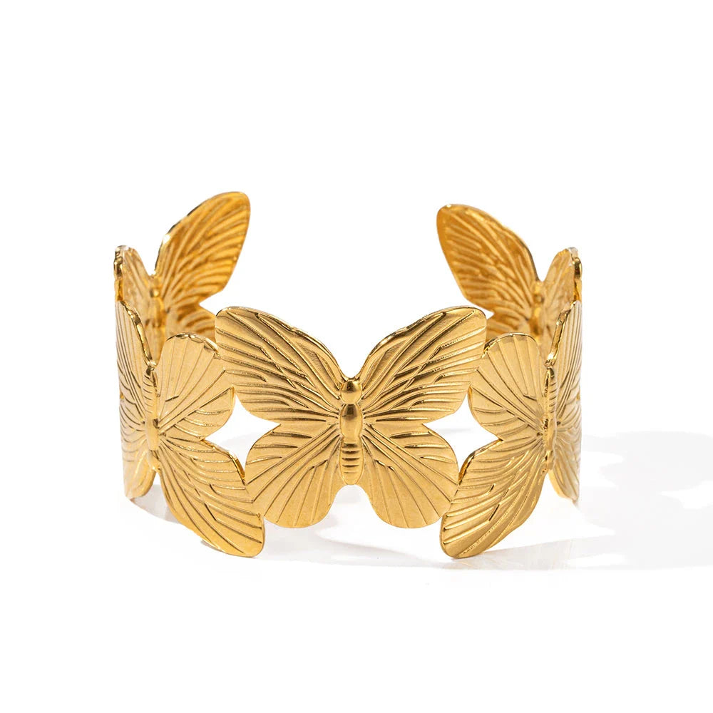 Stylish stainless steel bracelet with a butterfly design, featuring a luxurious 18K gold plating for a chic and sophisticated look.