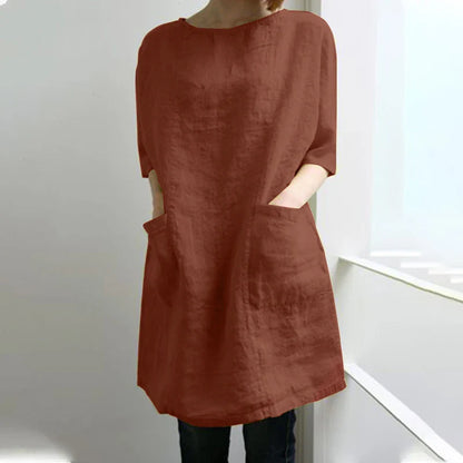 A cotton and linen dress with a round neckline, pockets, and an A-line silhouette in various colors.