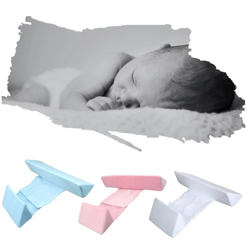 Ergonomic newborn baby sleep pillow with triangular design and removable pillowcase for comfortable, supported side sleeping