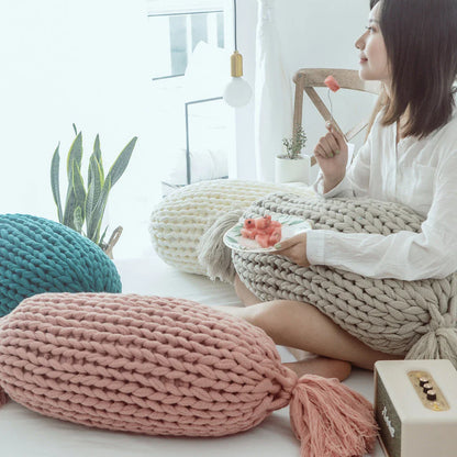 Cosy candy-shaped chunky knit pillow with adorable tassel design, perfect for adding a playful touch to your Kiwi home decor