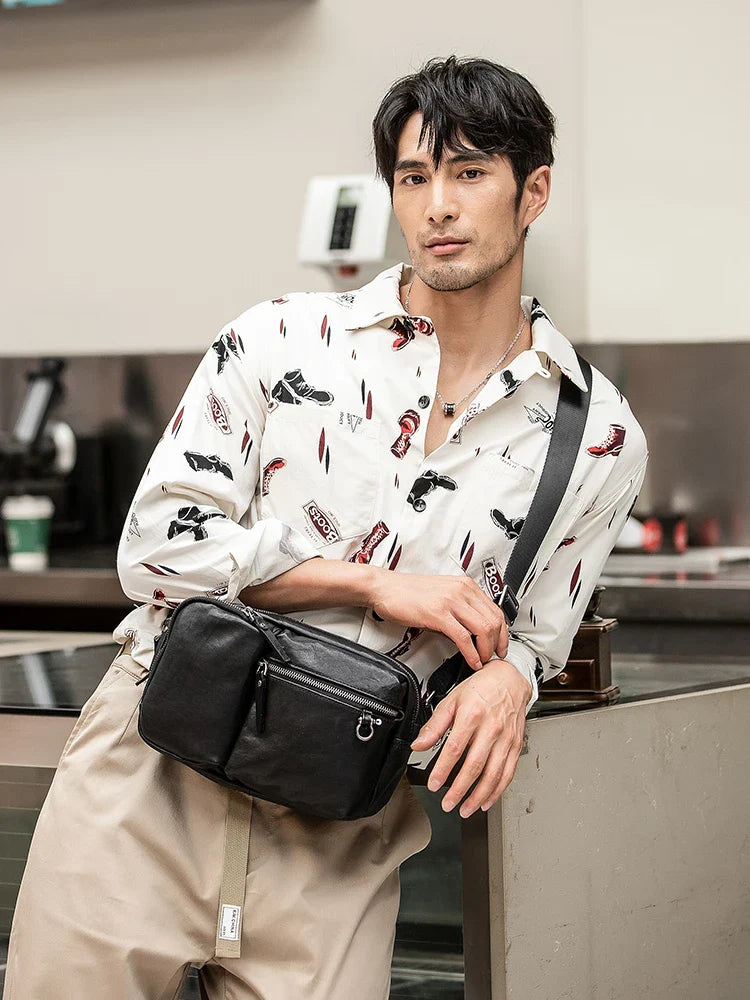 Stylish New Zealand-made leather shoulder bag in black for men, featuring a spacious design and adjustable strap for everyday use.