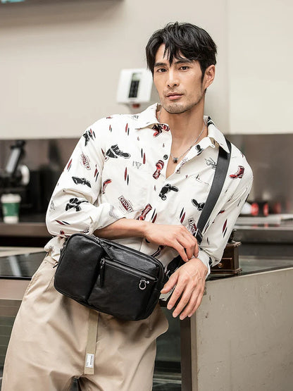 Stylish New Zealand-made leather shoulder bag in black for men, featuring a spacious design and adjustable strap for everyday use.