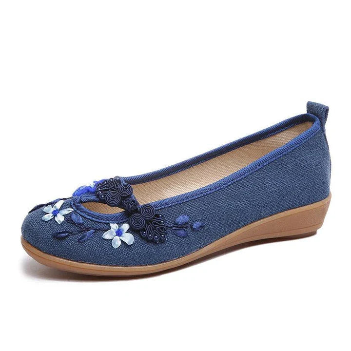 Trendha's Floral Buckle Low-top Shoes in various colors, showcasing a stylish suede upper and durable rubber sole for comfortable everyday wear.