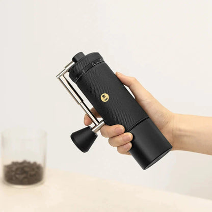 Premium manual coffee grinder with sleek design, stainless steel burrs, and external grind adjustment for customizable brewing