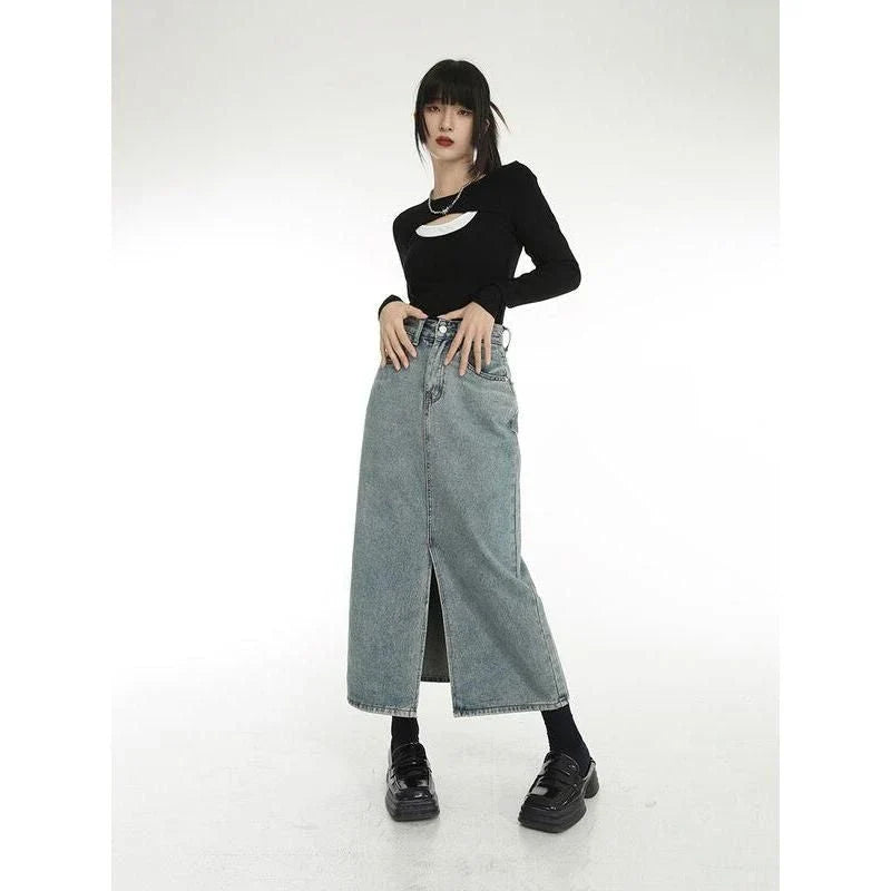 A stylish vintage-inspired denim midi skirt with a front slit, perfect for casual and special occasions.