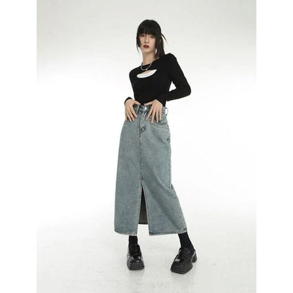 A stylish vintage-inspired denim midi skirt with a front slit, perfect for casual and special occasions.