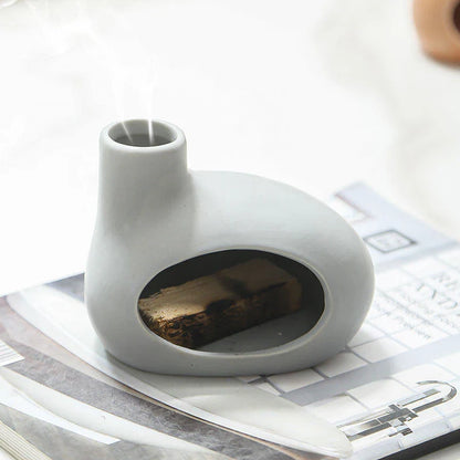 Elegant ceramic Palo Santo incense burner with modern, minimalist design in light brown, white, and gray color options