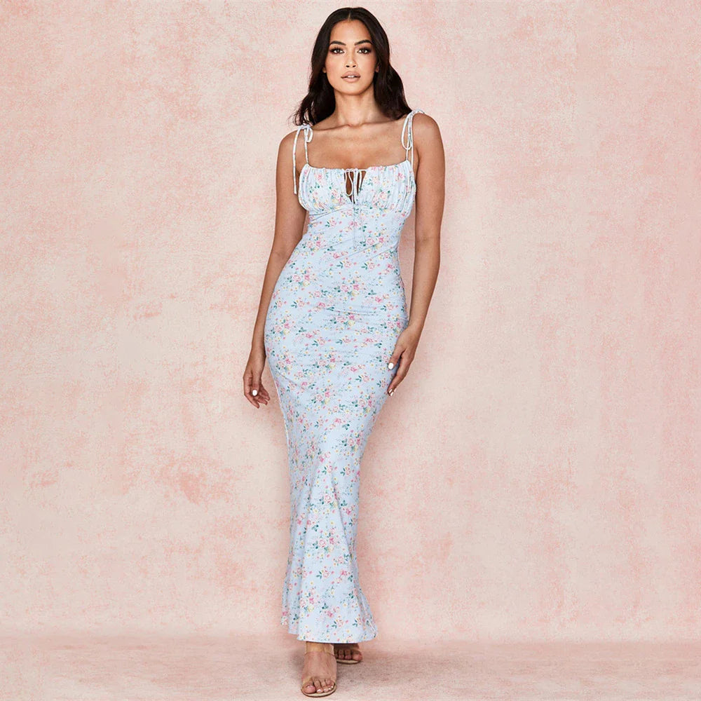 Floral lace sling dress in blue, featuring a delicate floral pattern and sling style for a stylish and comfortable Kiwi-inspired look.