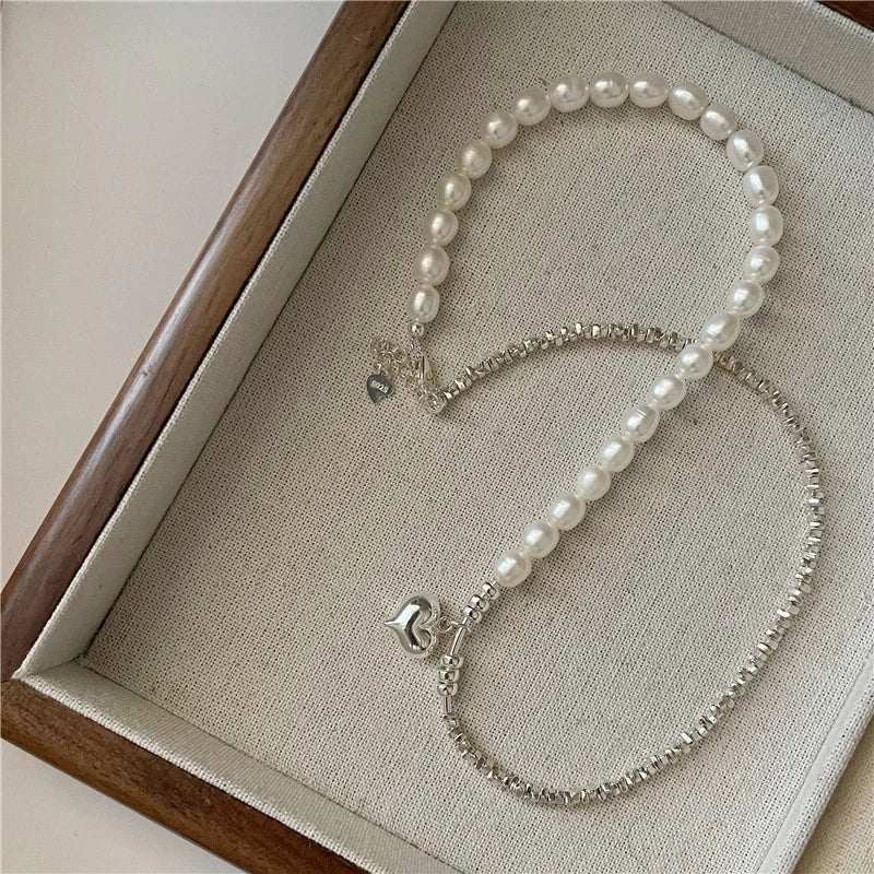 Elegant heart-shaped pearl and sterling silver necklace, a timeless accessory for the modern New Zealand style.