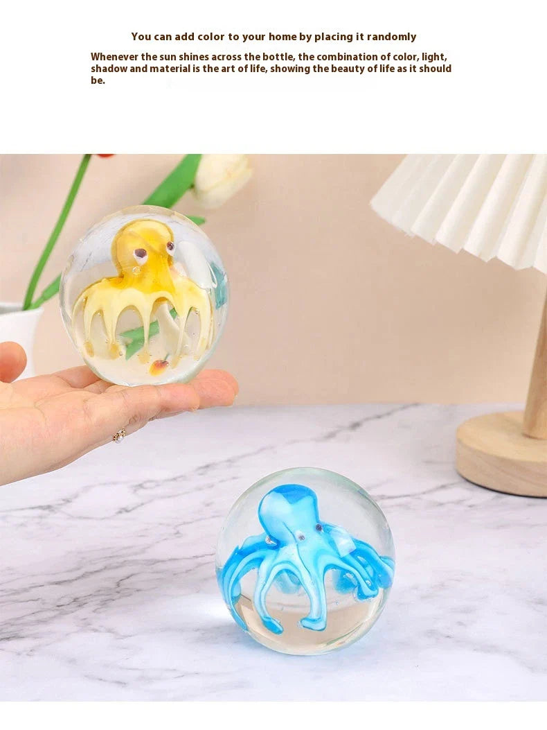 Handcrafted glass octopus windshield washer fluid ornament in ocean blue and tea brown colours, made in New Zealand