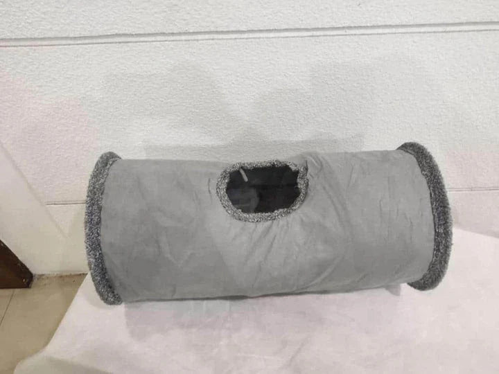 Collapsible cat tunnel toy made of soft, durable polyester fabric in gray color