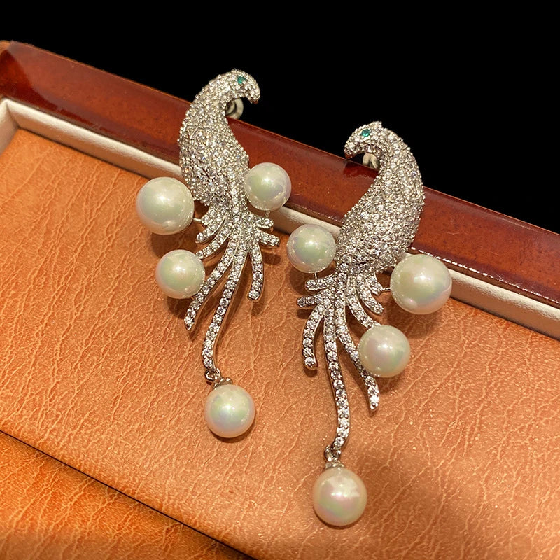 Elegant bird-themed pearl and tassel stud earrings in a versatile design