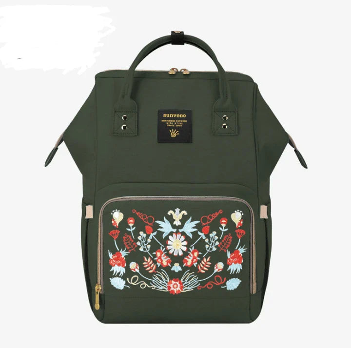 Stylish and practical mummy bag with reinforced handles, durable buckles, and separate bottling area for Kiwi mums