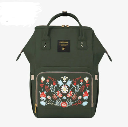 Stylish and practical mummy bag with reinforced handles, durable buckles, and separate bottling area for Kiwi mums