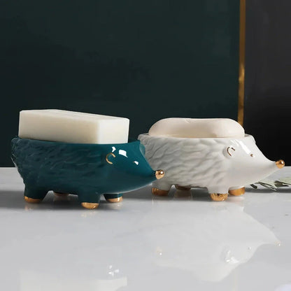 Charming hedgehog-shaped ceramic soap dish in green and white colours for bathroom decor