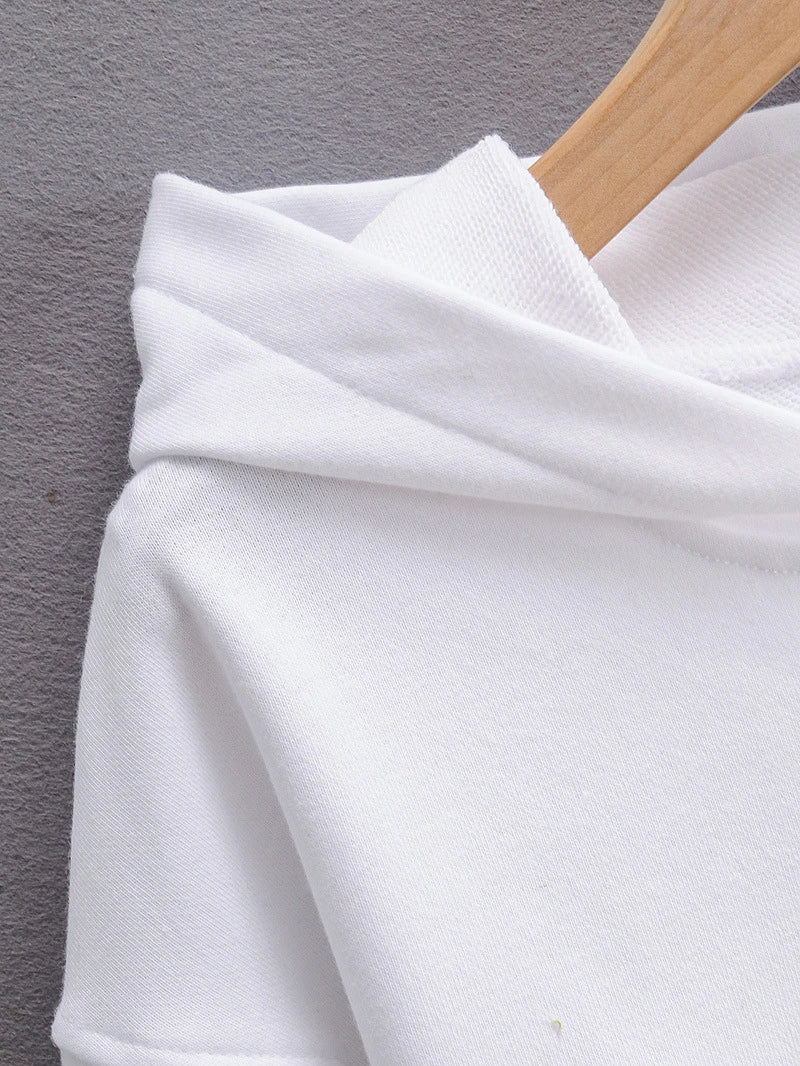 A slim-fit hooded jumper in white with a distinctive navel accent, a must-have Kiwi streetwear style.