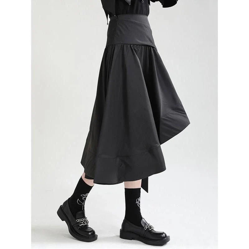 A stylish asymmetric ruffle skirt in a high-waist design, made from a durable cotton-polyester blend fabric.