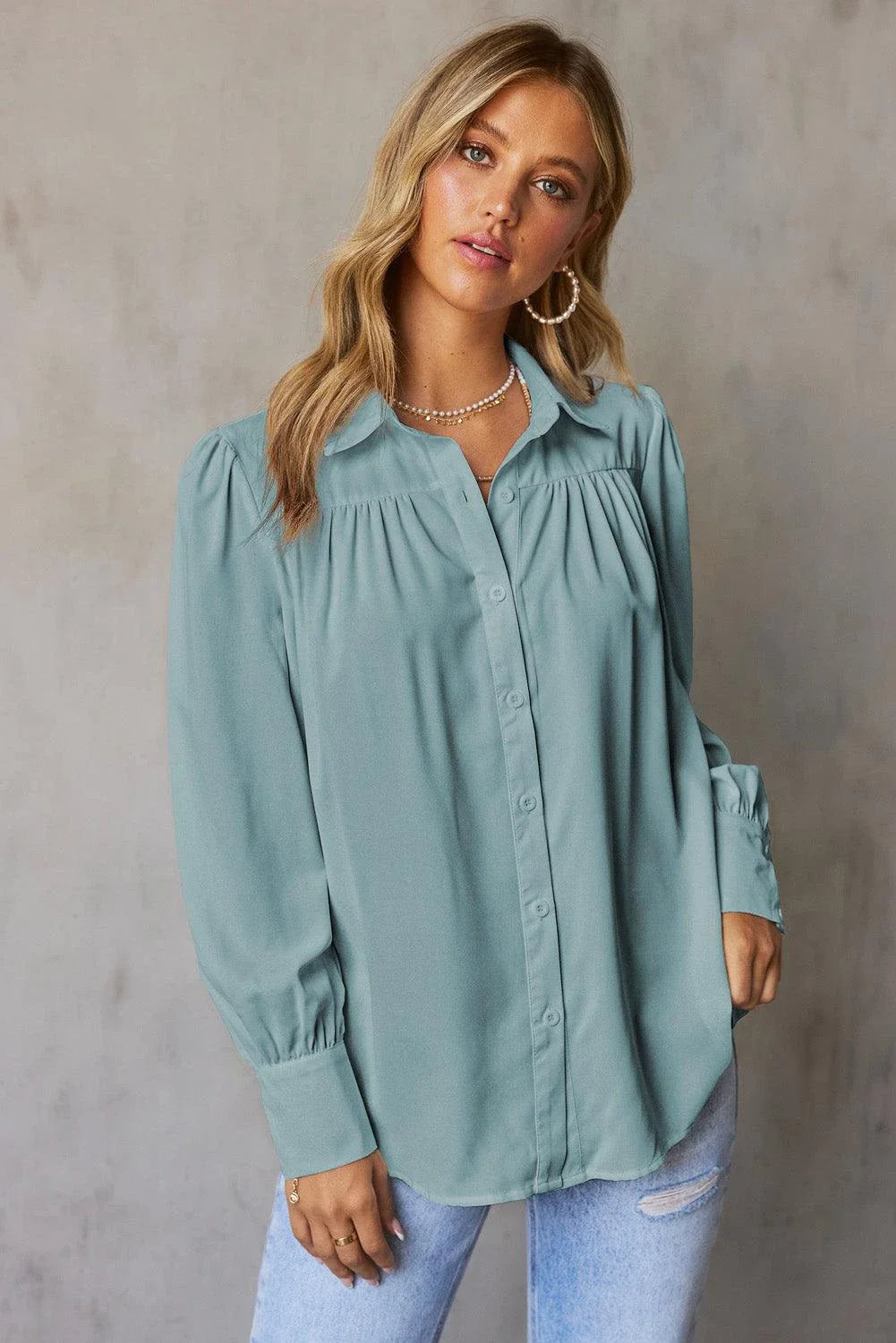 Gathered Detail Puff Sleeve Shirt in blue, featuring a collared neckline, buttoned front, and distinct puff sleeves for a timeless Kiwi style.