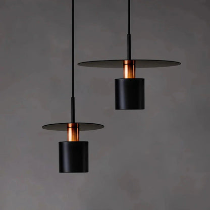 A modern, minimalist pendant light with a sleek, painted metal design, perfect for enhancing the ambiance of cafes, bedrooms, and other contemporary interior spaces.