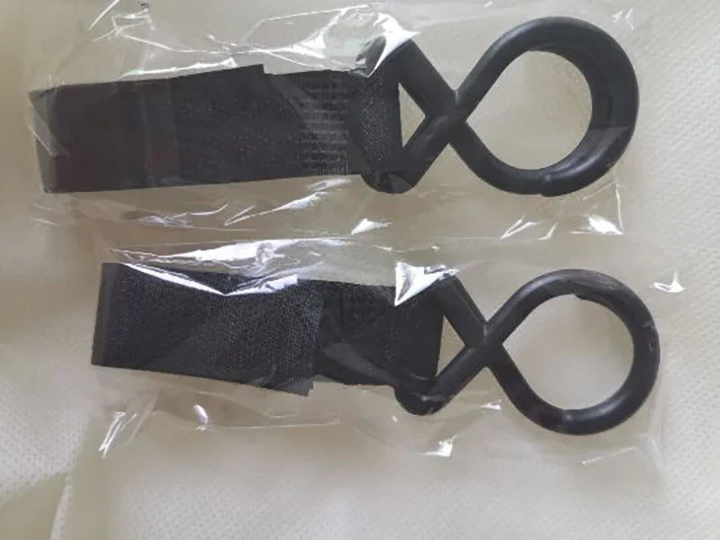 Versatile mum's backpack with pink color, featuring side pockets, zippered compartments, and stroller attachment hooks