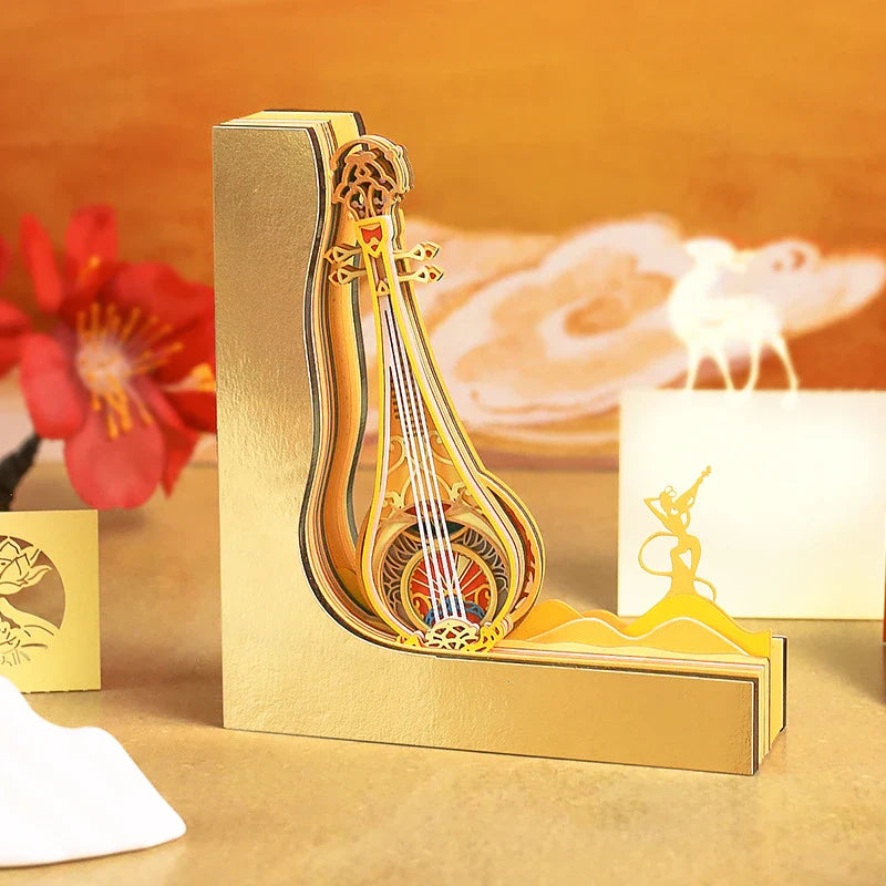 A three-dimensional paper carving notepad with a stunning Dunhuang Pipa design, a captivating desk accessory for the modern Kiwi office.