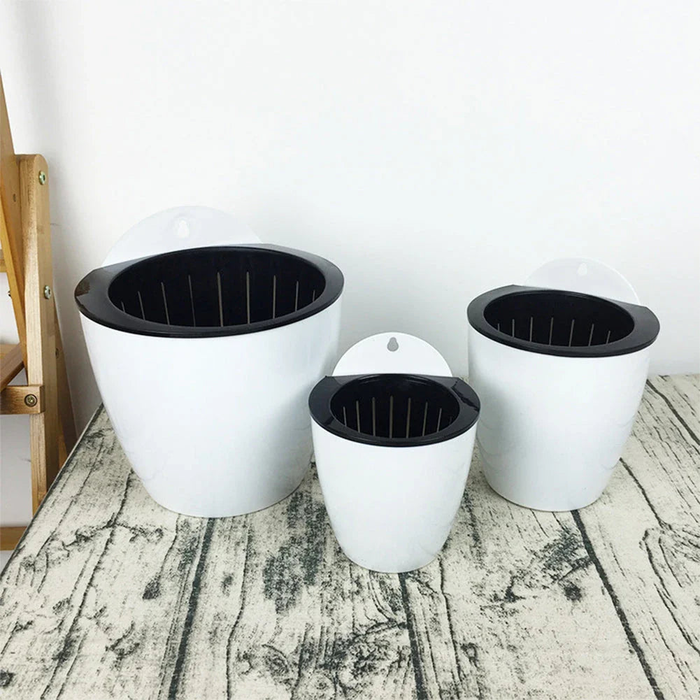 Sleek, wall-mounted hydroponic planter with vertical design, dual-basket system, and automatic watering for easy indoor gardening in New Zealand homes and offices.