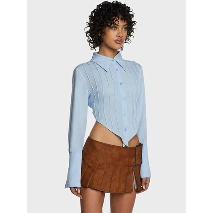 Stylish blue blouse with lace-up back and V-shaped hem, a versatile wardrobe staple with a touch of modern elegance.