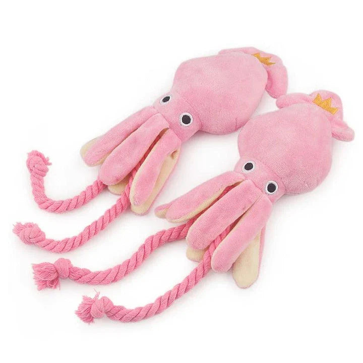 Cuddly pink squid-shaped plush toy for dogs, made of soft fleece material for snuggles and play