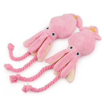 Cuddly pink squid-shaped plush toy for dogs, made of soft fleece material for snuggles and play