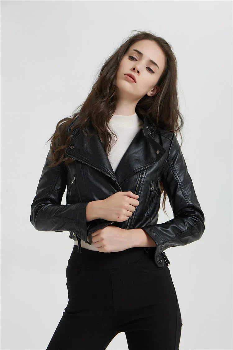 Trendha Women's Short Leather Jacket in Black, featuring a weathered finish and rivet detailing for a stylish, urban-inspired look