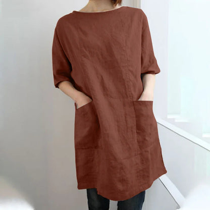 A cotton and linen dress with a round neckline, pockets, and an A-line silhouette in various colors.