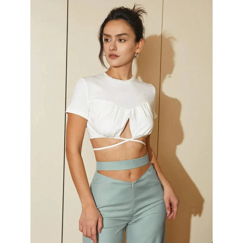 Stylish white crop top with crisscross tie-back design, perfect for Kiwi fashion enthusiasts