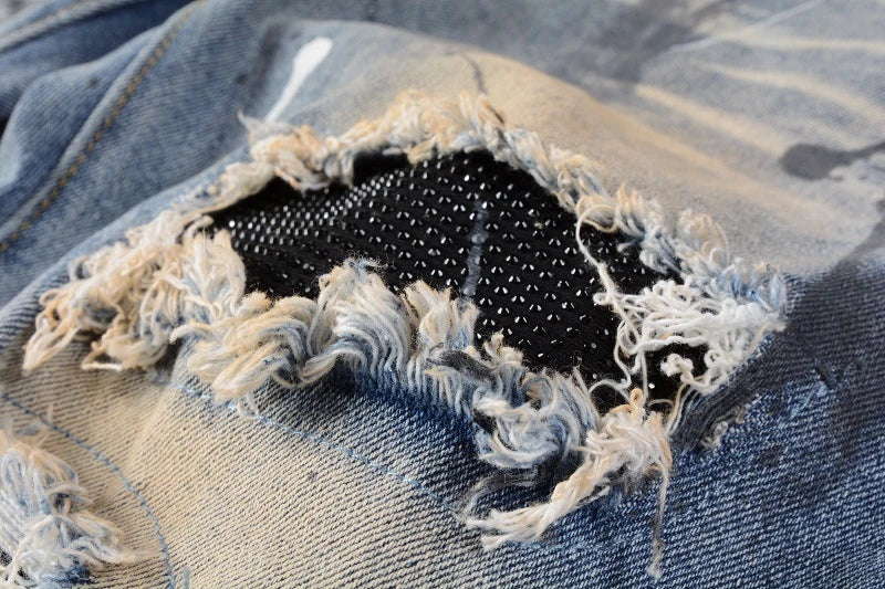 Vintage-inspired jeans with rhinestone and ink splash detailing, perfect for the modern Kiwi lifestyle