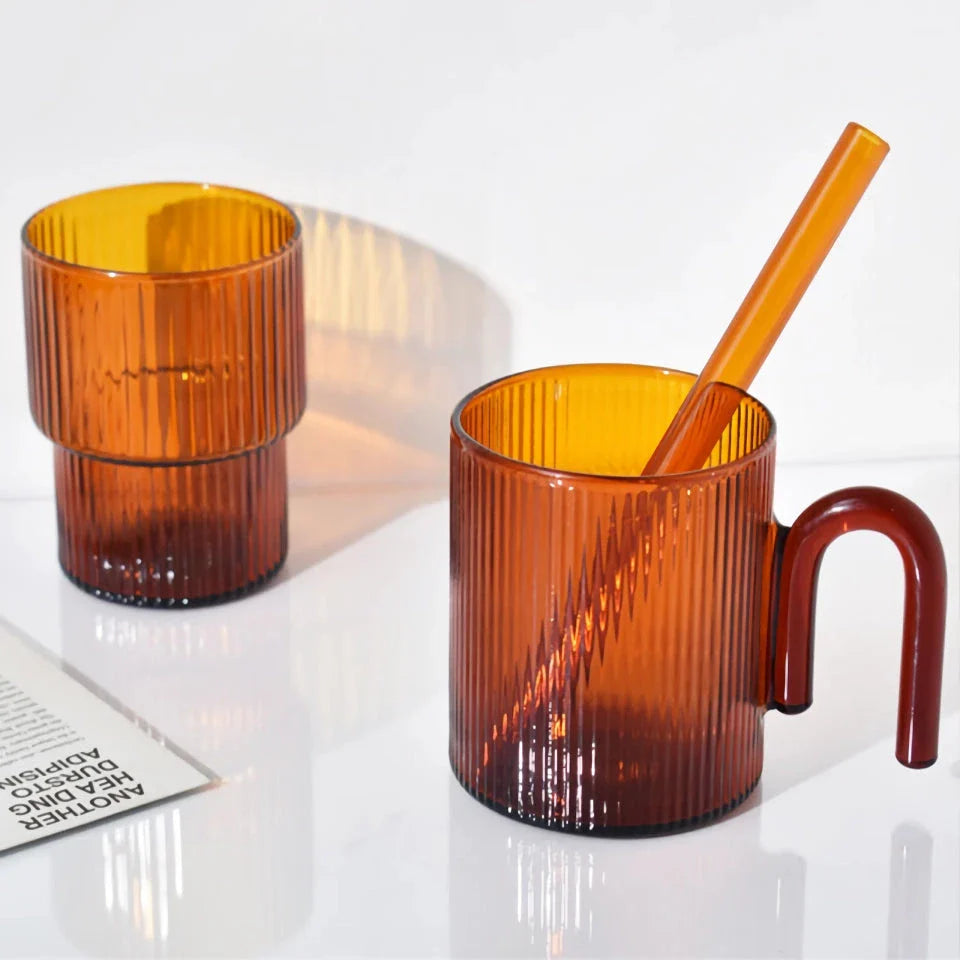 Stylish heat-resistant glass mug with vibrant colourful handle, perfect for hot beverages