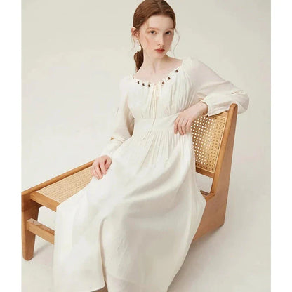 Elegant Kiwi-Inspired Romantic Dress with full-length sleeves, empire waistline, and A-line silhouette