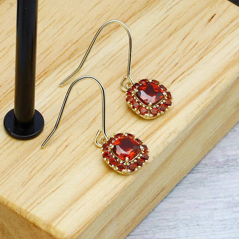 Stylish red pomegranate-inspired earrings made from premium silver with a modern, geometric design