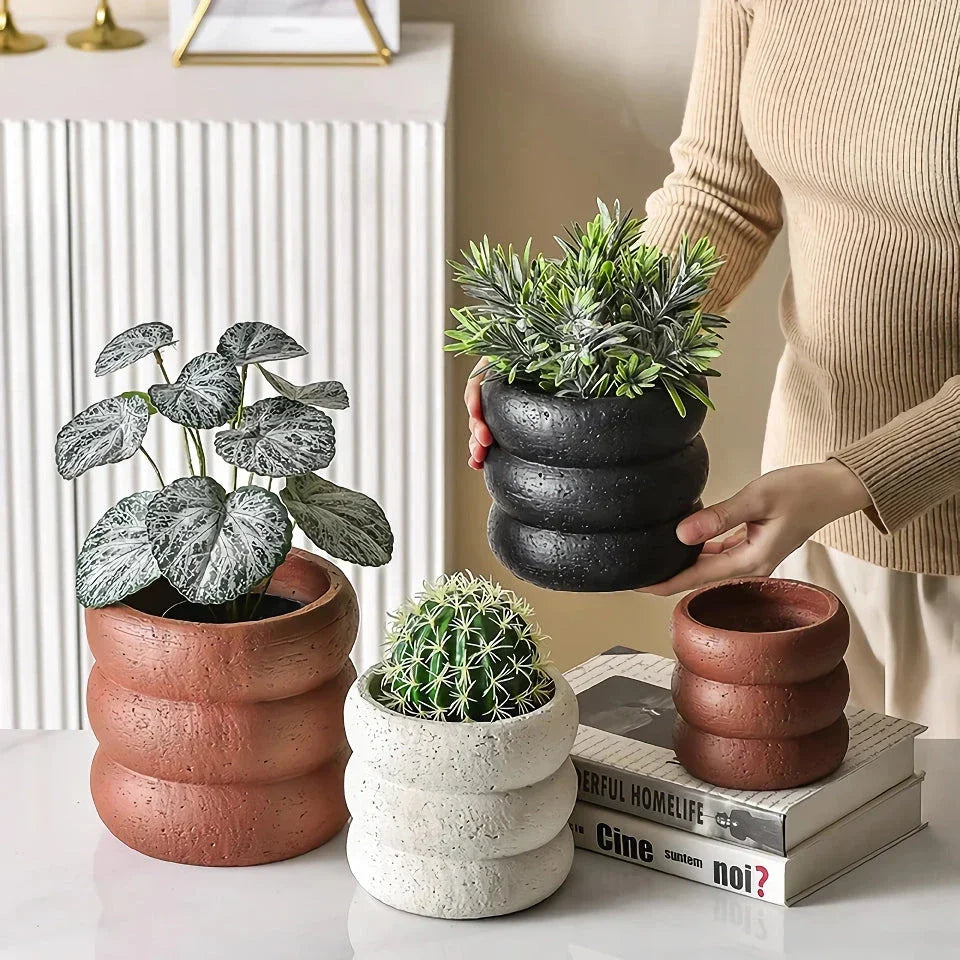 Stylish modern minimalist cement flower pots in two sizes, perfect for showcasing plants and greenery in a Kiwi home