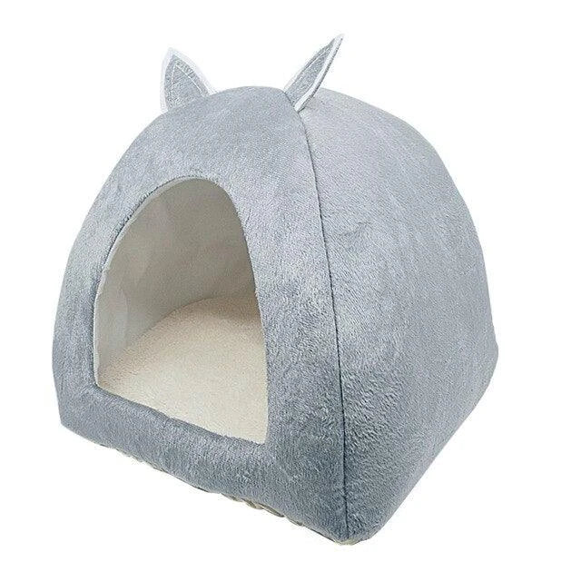 Cosy and foldable cat bed with interactive ball toy, available in a range of stylish colours to match your home decor