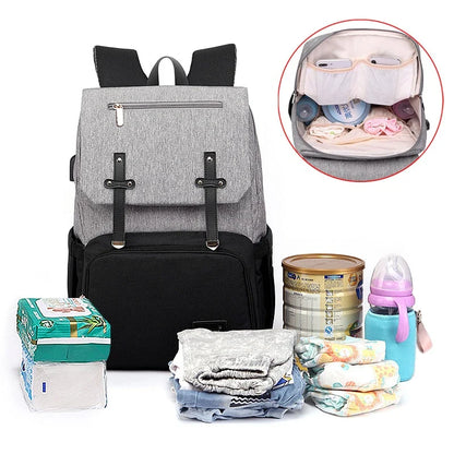 Versatile Mummy Daddy Backpack in Grey, a functional and stylish nappy bag for Kiwi families with a spacious main compartment, insulated pockets, and a USB charging port.