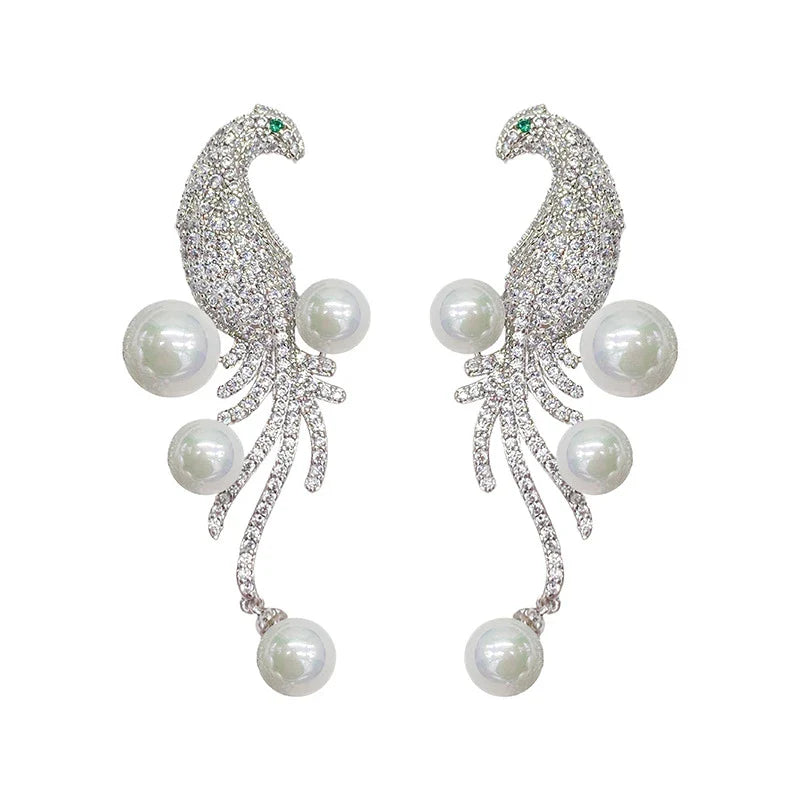 Elegant bird-themed pearl and tassel stud earrings in a versatile design