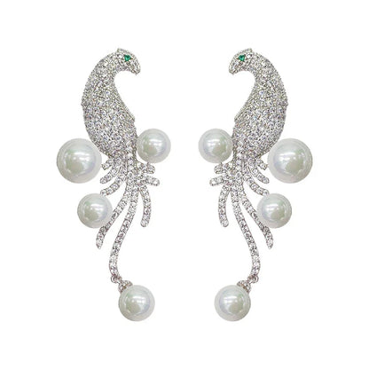 Elegant bird-themed pearl and tassel stud earrings in a versatile design