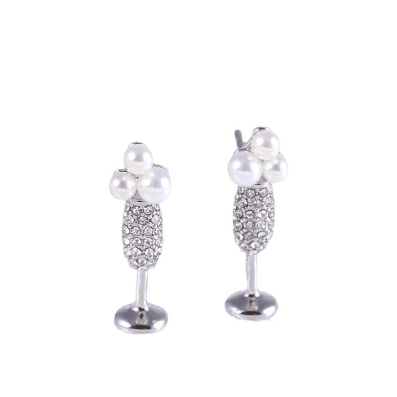 Stunning silver-plated earrings featuring a pearl inlay design, perfect for adding a touch of elegance to any outfit.