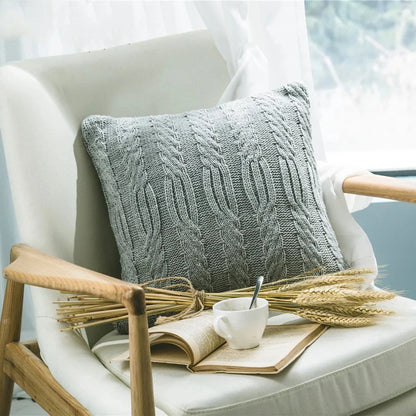 Elegant grey knitted decorative pillow case with intricate jacquard pattern and embroidered stripes